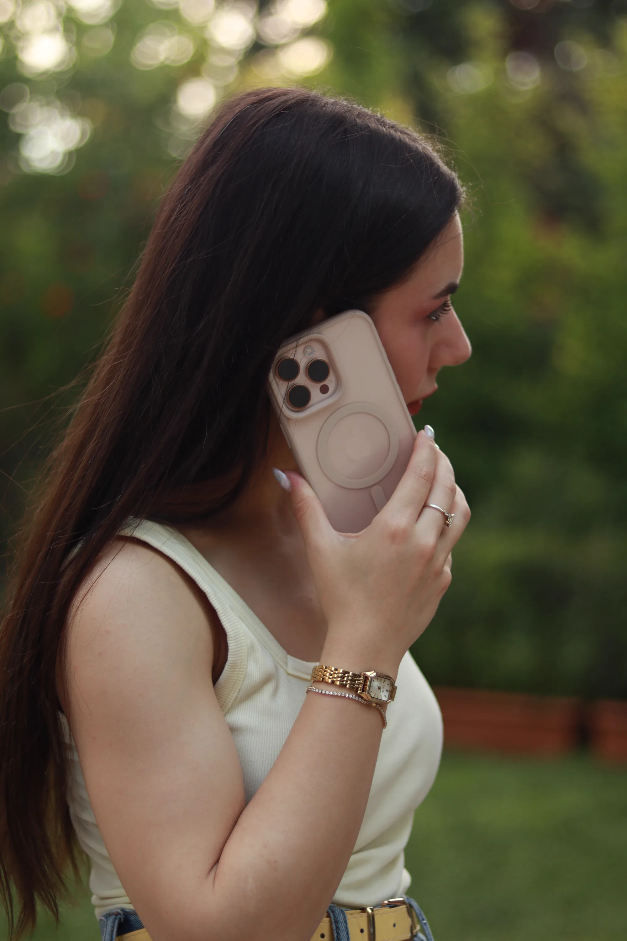 A woman holding a smartphone to her ear